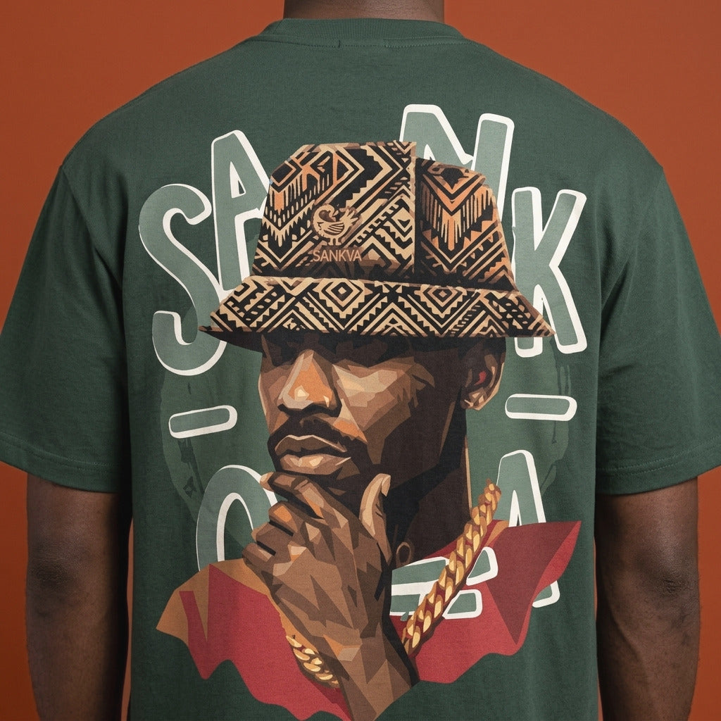 Blackness Sankofa King Tee, deep forest green — close-up of the Sankofa back print worn, terracotta backdrop