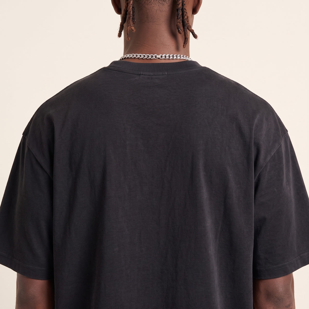 Base Blackness Tee Black — upper back detail, clean plain back and drop-shoulder seams, oversized heavyweight cotton streetwear tee by We Are Blackness