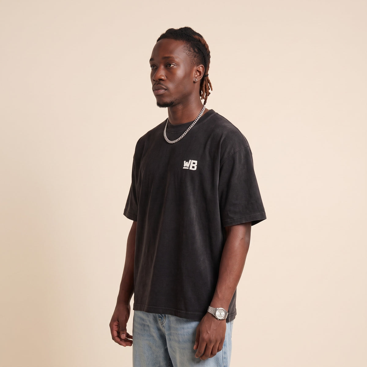 Blackness Emancipation Tee Black — side view of the drop-shoulder sleeve and boxy oversized fit, oversized heavyweight cotton streetwear tee by We Are Blackness