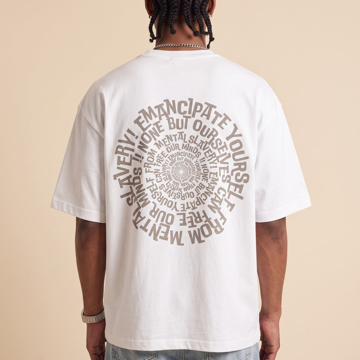 Blackness Emancipation Tee White — close-up of the spiral Emancipate Yourself typography back print worn on the back, oversized heavyweight cotton streetwear tee by We Are Blackness