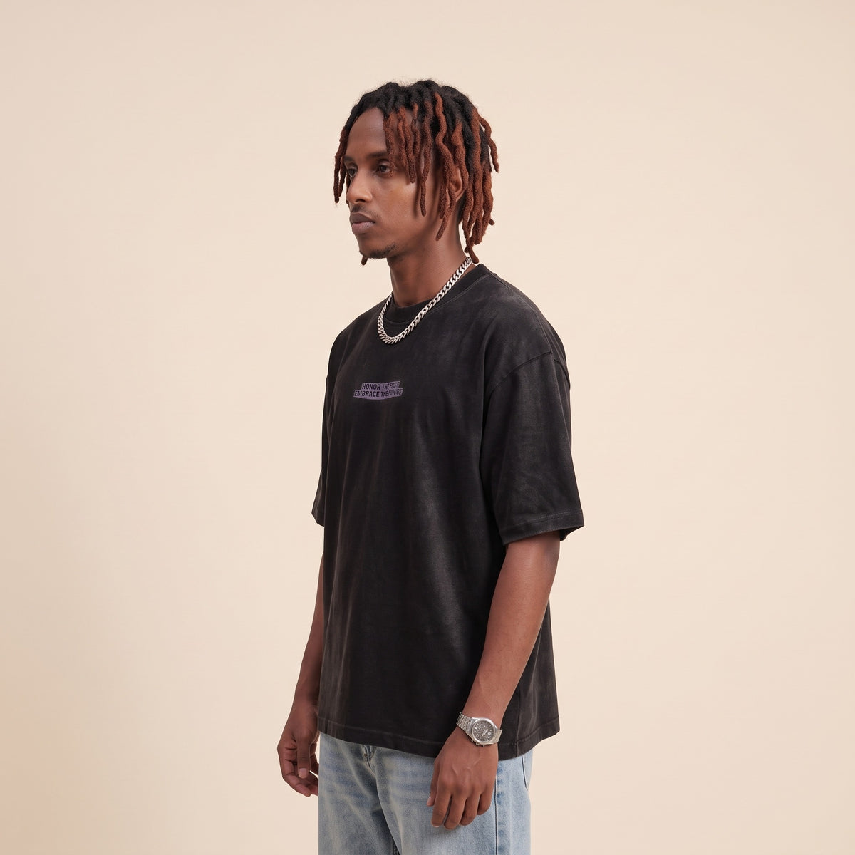 Blackness Honor & Embrace Tee Black — side view of the drop-shoulder sleeve and boxy oversized fit, oversized heavyweight cotton streetwear tee by We Are Blackness