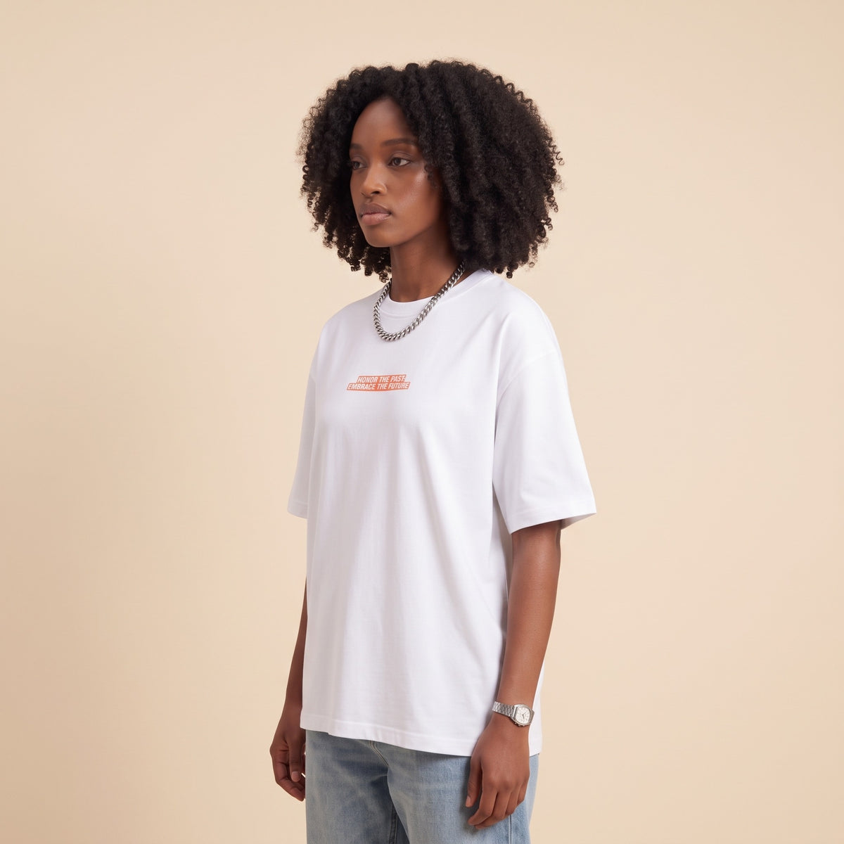 Blackness Honor & Embrace Tee White — side view of the drop-shoulder sleeve and boxy oversized fit, oversized heavyweight cotton streetwear tee by We Are Blackness