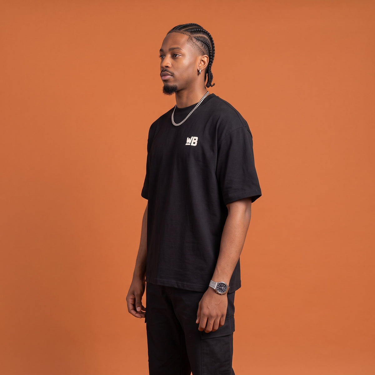 Blackness Mawon Tee Black — side view of the drop-shoulder sleeve and boxy oversized fit, oversized heavyweight cotton streetwear tee by We Are Blackness