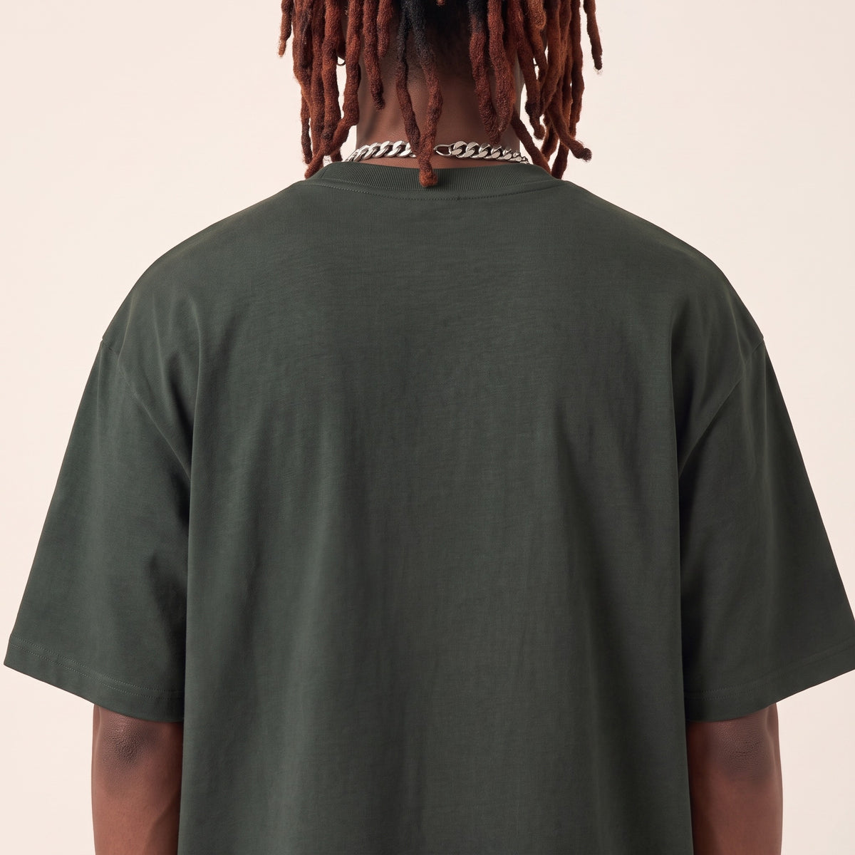 Wear Blackness Tee Green — upper back detail, clean plain back and drop-shoulder seams, oversized heavyweight cotton streetwear tee by We Are Blackness
